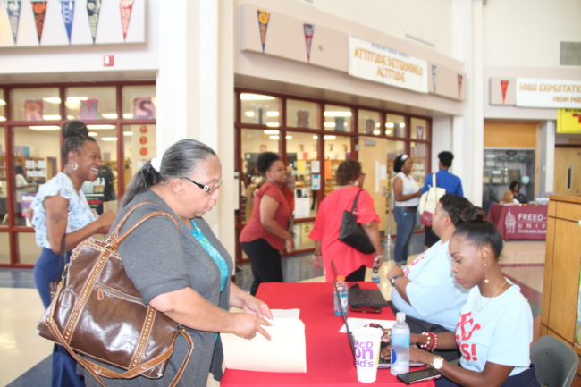 Semi-retired kindergarten teacher Sandra Jenkins checks in with district personnel at a Shelby County Schools job fair. July 11, 2019.